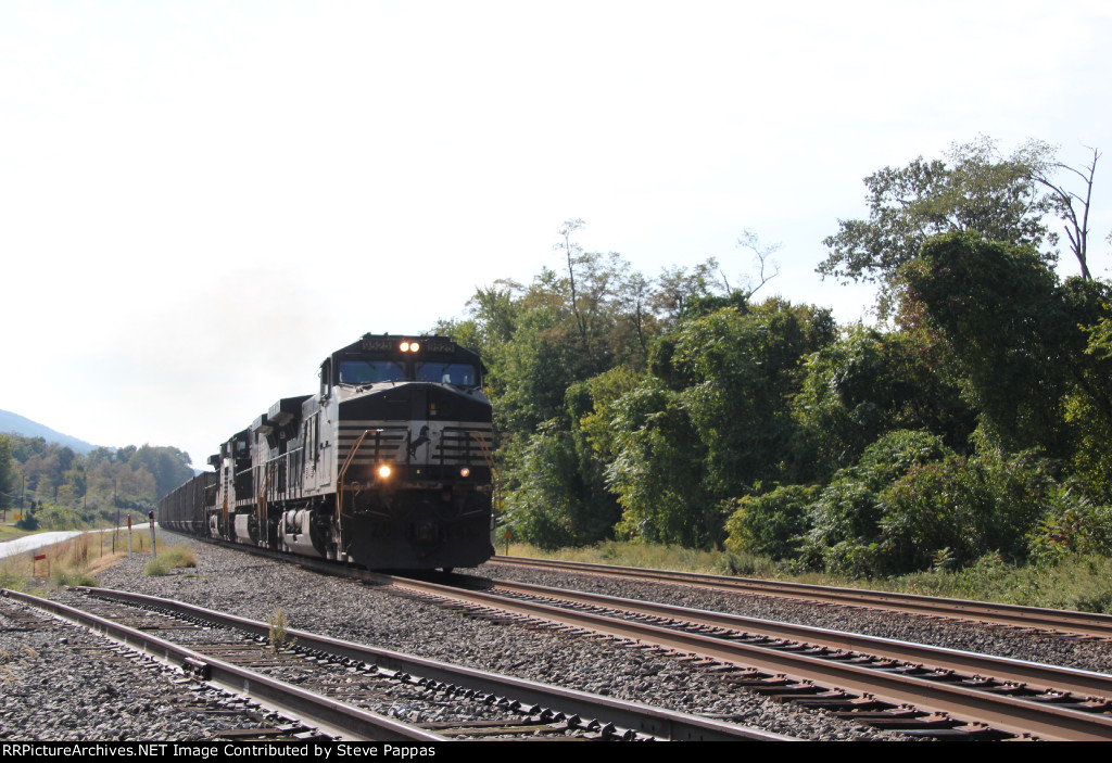 NS 9525 with an eastbound string of coal  hoppers
